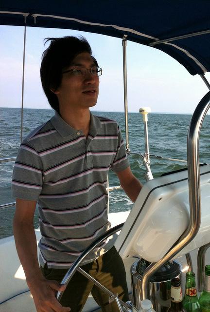 Our visitor Ryuzo Nakanishi navigating us back to shore, sailing trip 2012.
