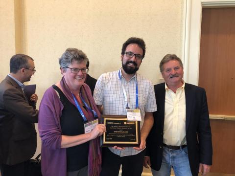 Etienne Garand getting the J Phys Chem Lecture Award at the PHYS division reception (ACS meeting in Boston).