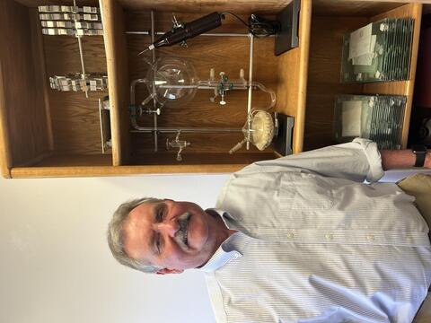 Mark next to one of the few remaining Urey-Miller apparatus, currently held at UCSD. 